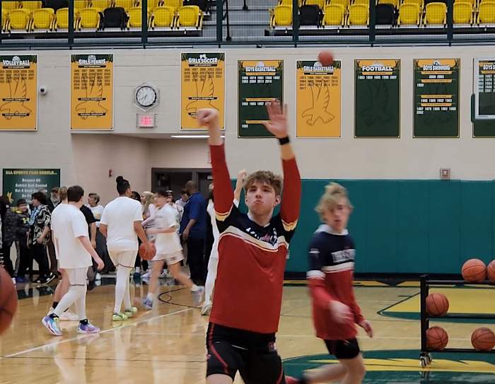 Cornerstone Christian Academy junior Quinn "Turtle" Kwasniak warms up before their district semifinal game against Fairport Harbor at Firestone High School in Akron on March 5, 2024.